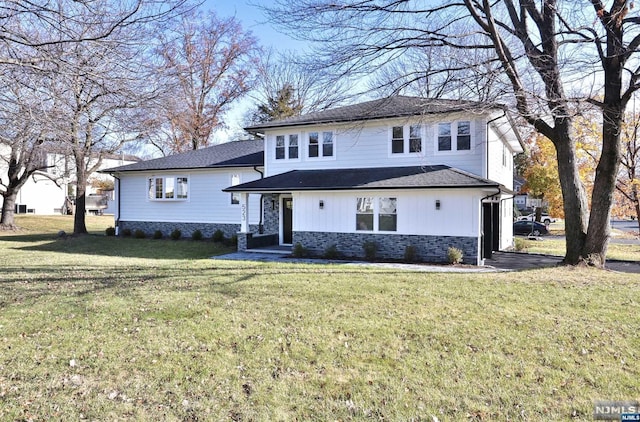 front facade with a front yard