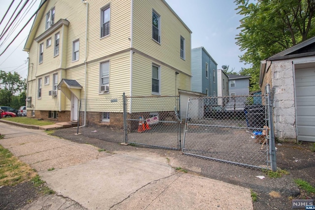 view of side of property with cooling unit