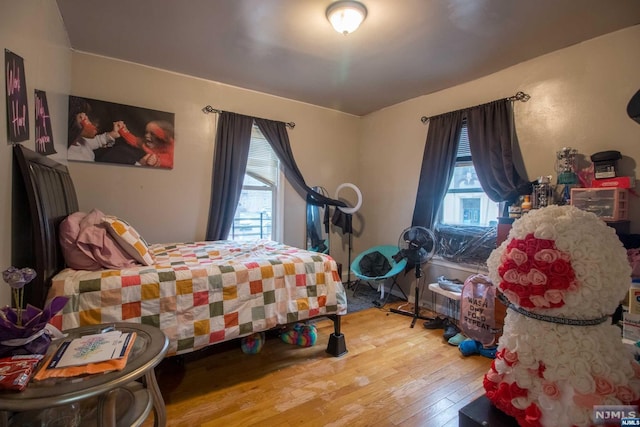 bedroom with hardwood / wood-style flooring