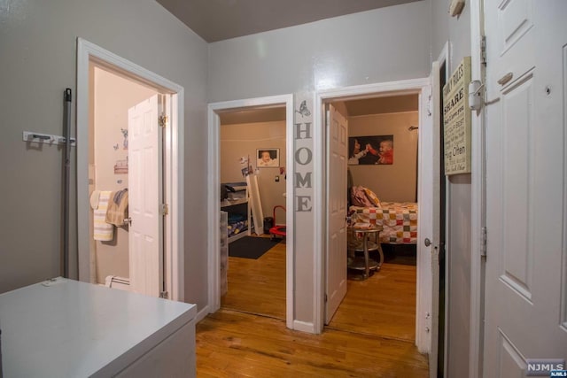 corridor featuring light hardwood / wood-style flooring