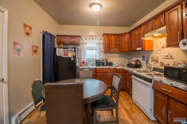 kitchen with a baseboard heating unit, black appliances, sink, light hardwood / wood-style floors, and light stone counters