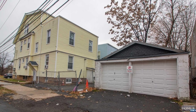 exterior space featuring an outbuilding and a garage