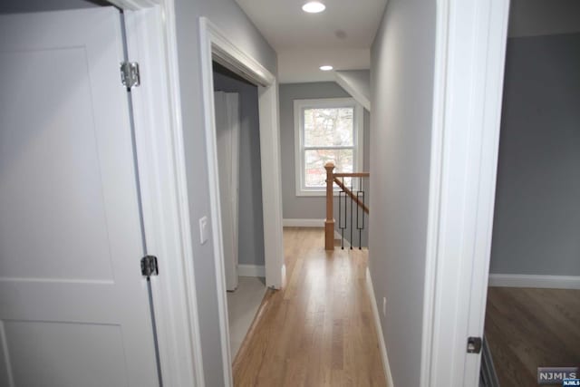 hallway with light wood-type flooring