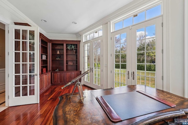 doorway to outside featuring french doors, ornamental molding, a wealth of natural light, and dark wood-type flooring