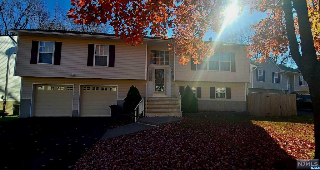 bi-level home featuring a garage