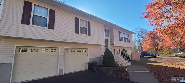 view of property exterior with a garage