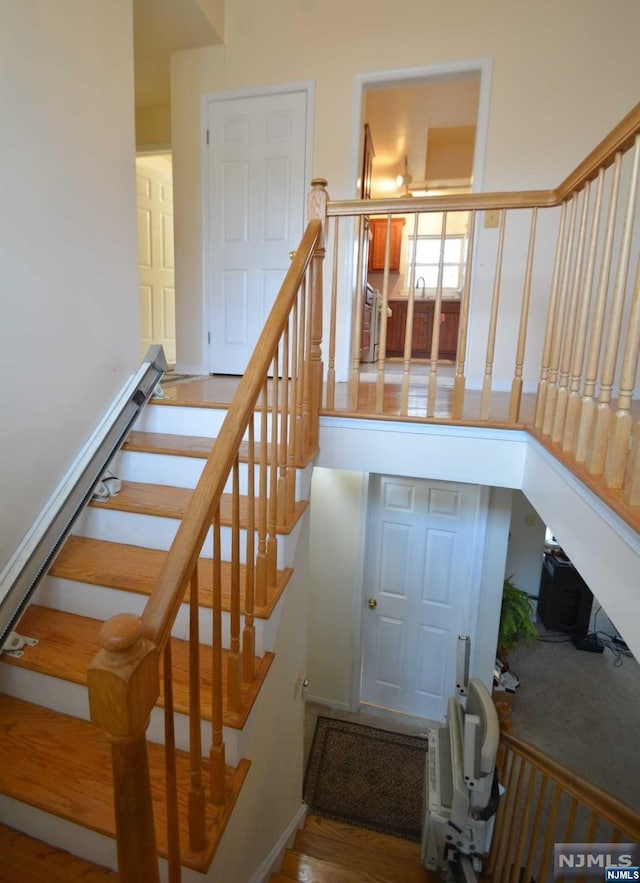 stairway with wood-type flooring