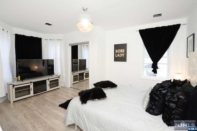 bedroom with light wood-type flooring