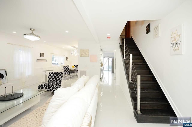 living room with tile patterned floors and a wealth of natural light