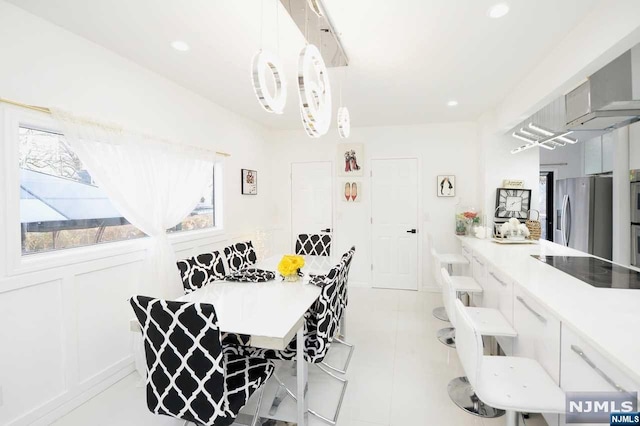 tiled dining space featuring breakfast area