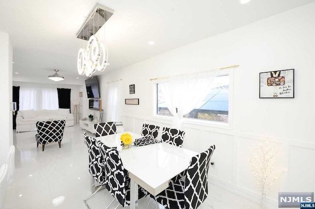 dining area featuring a notable chandelier