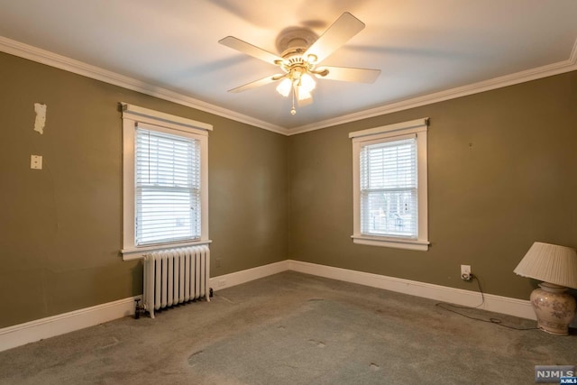 unfurnished room with radiator heating unit, carpet floors, plenty of natural light, and ceiling fan