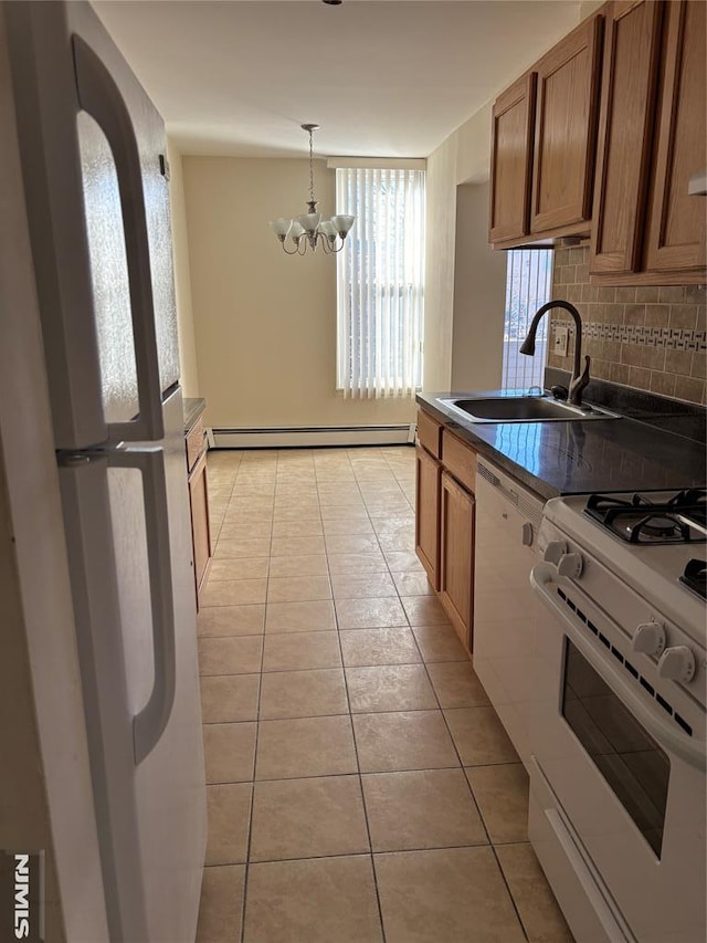 kitchen with sink, tasteful backsplash, a baseboard heating unit, a notable chandelier, and white appliances