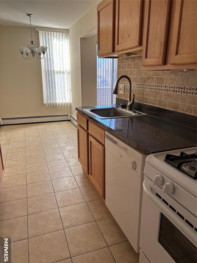 kitchen featuring white appliances, baseboard heating, sink, light tile patterned floors, and a notable chandelier