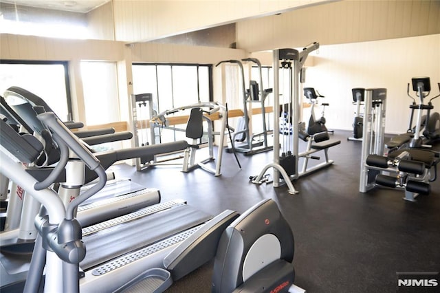 workout area featuring a high ceiling