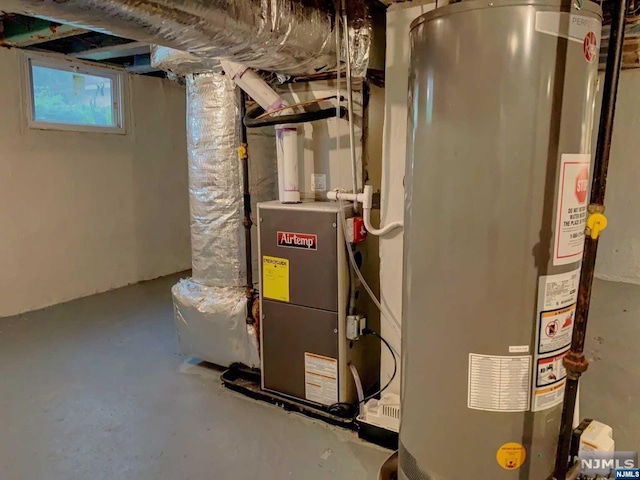 utility room featuring gas water heater