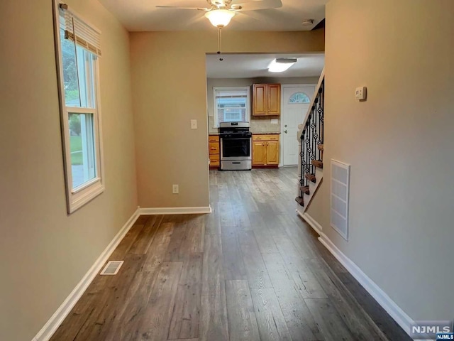 corridor featuring dark hardwood / wood-style flooring