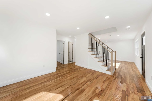 unfurnished living room with light hardwood / wood-style floors