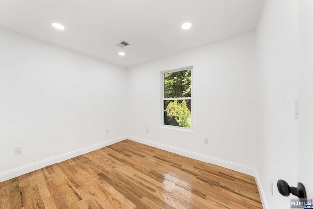 unfurnished room featuring light hardwood / wood-style flooring