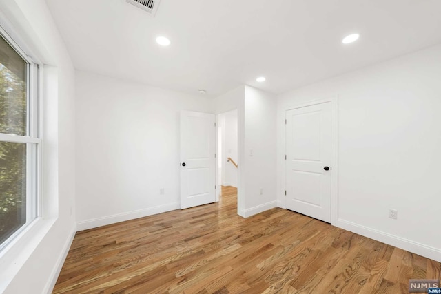 unfurnished room featuring light hardwood / wood-style flooring