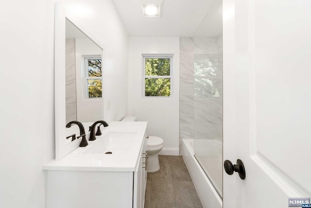 full bathroom with tile patterned flooring, vanity, tub / shower combination, and toilet