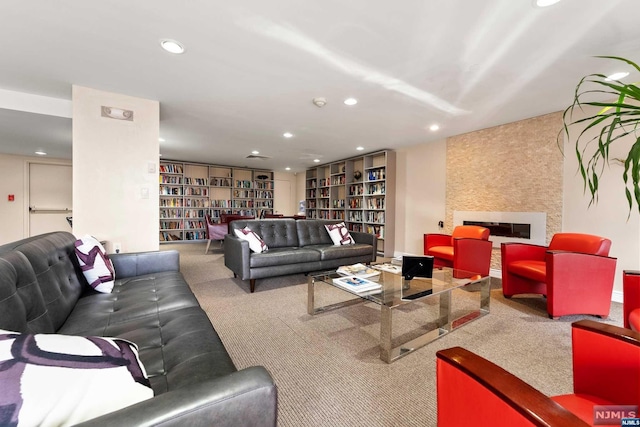 carpeted living room with a fireplace