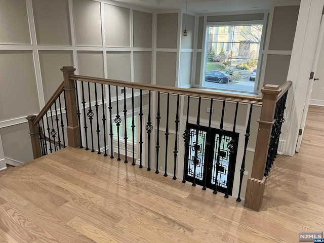 stairway featuring hardwood / wood-style flooring