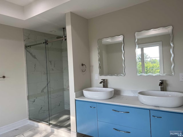 bathroom with vanity, wood-type flooring, and walk in shower