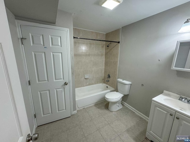 full bathroom with toilet, vanity, tile patterned floors, and tiled shower / bath