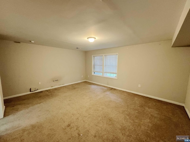 view of carpeted spare room