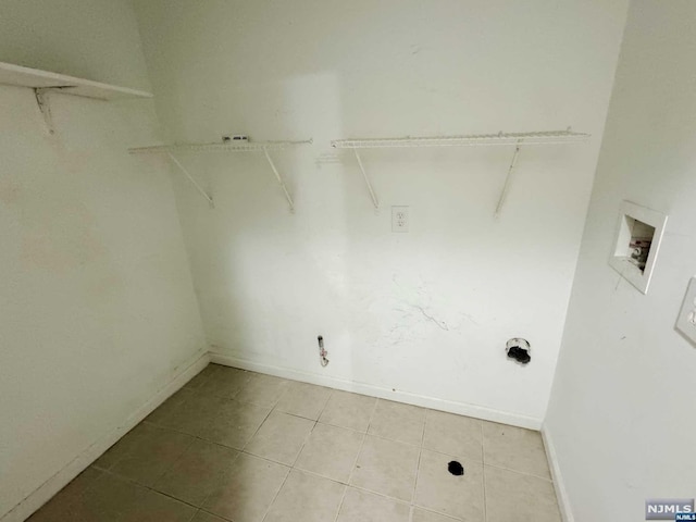 laundry room with hookup for a washing machine and tile patterned floors