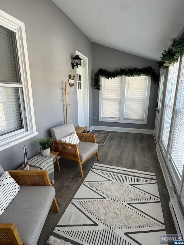 sunroom / solarium featuring lofted ceiling