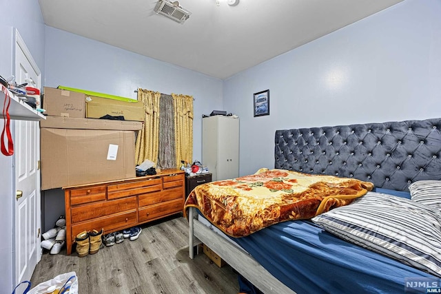 bedroom featuring wood-type flooring