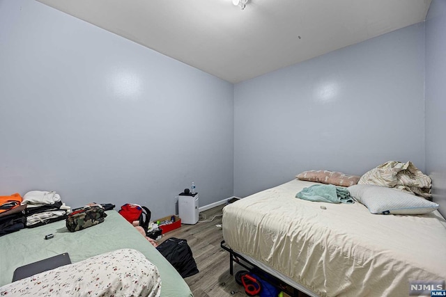 bedroom with light hardwood / wood-style floors