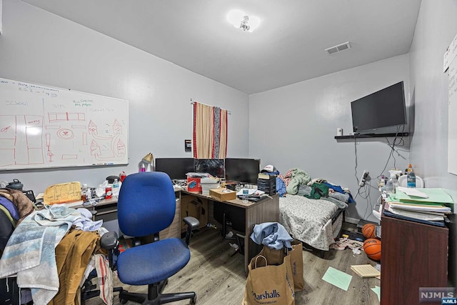 office with light wood-type flooring