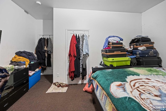 bedroom with dark carpet