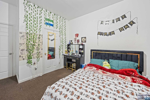 bedroom with dark carpet