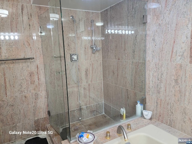 bathroom with a shower stall