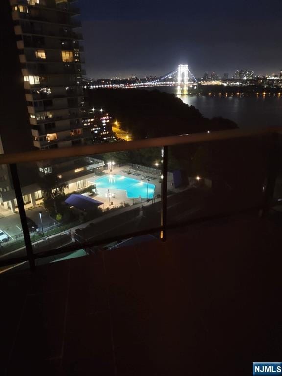 pool at night with a view of city lights