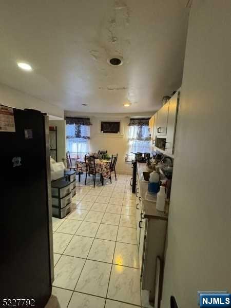 living room with light tile patterned floors