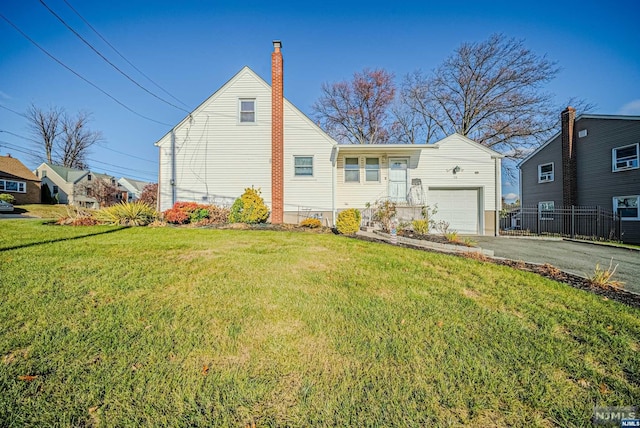 view of front facade with a front lawn and a garage