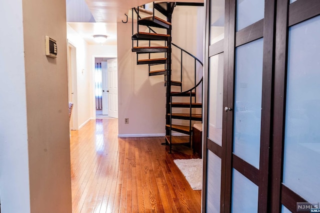 corridor featuring hardwood / wood-style floors