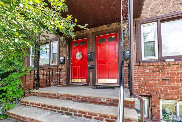 doorway to property with a porch