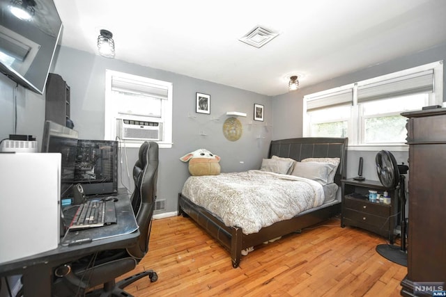 bedroom with light hardwood / wood-style floors