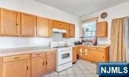 kitchen with white range oven and extractor fan