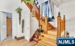 stairs featuring hardwood / wood-style flooring