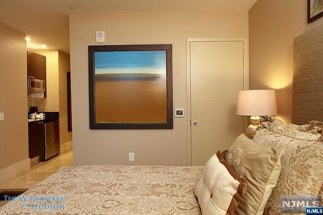 bedroom with light tile patterned flooring