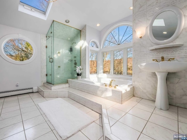 bathroom featuring plus walk in shower, a skylight, tile patterned floors, and a baseboard radiator