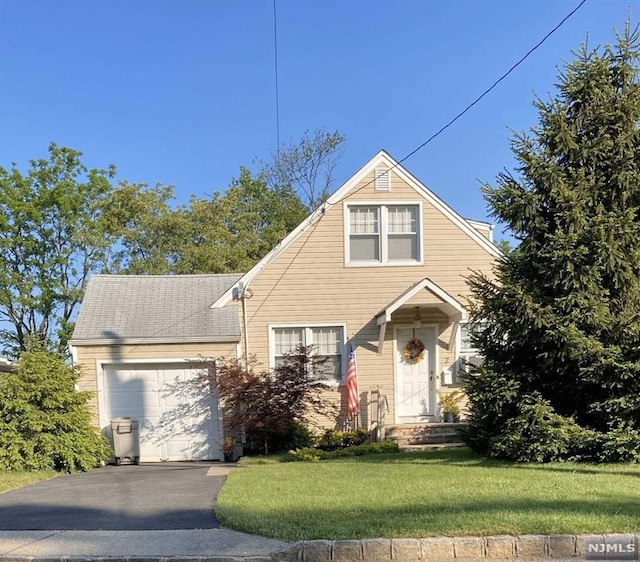 view of front property with a front yard and a garage