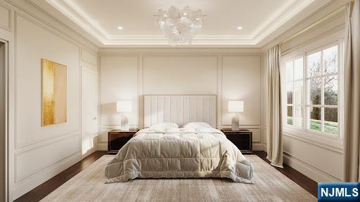 bedroom featuring crown molding and dark hardwood / wood-style flooring